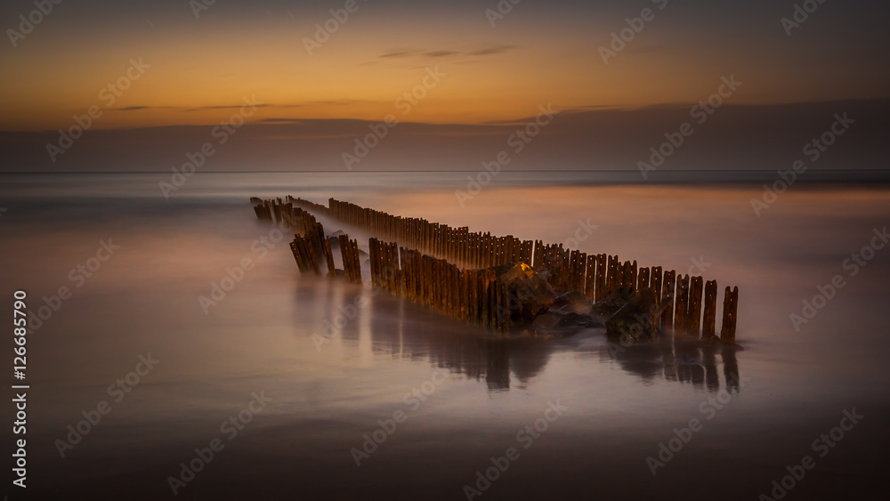 Obraz premium Night, wave breaker in the black sea, Poti, Georgia
