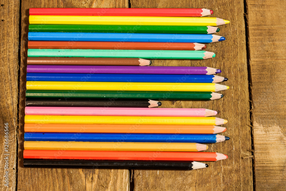 table set with colorful pencils table set with colorful pencils