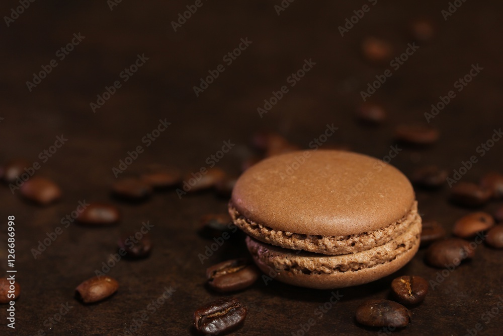French macarons on dark moody background, shallow depth of field French macarons on dark moody background, shallow depth of field