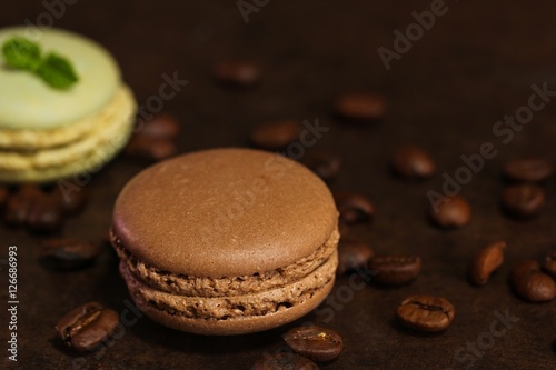 French macarons on dark moody background, shallow depth of field