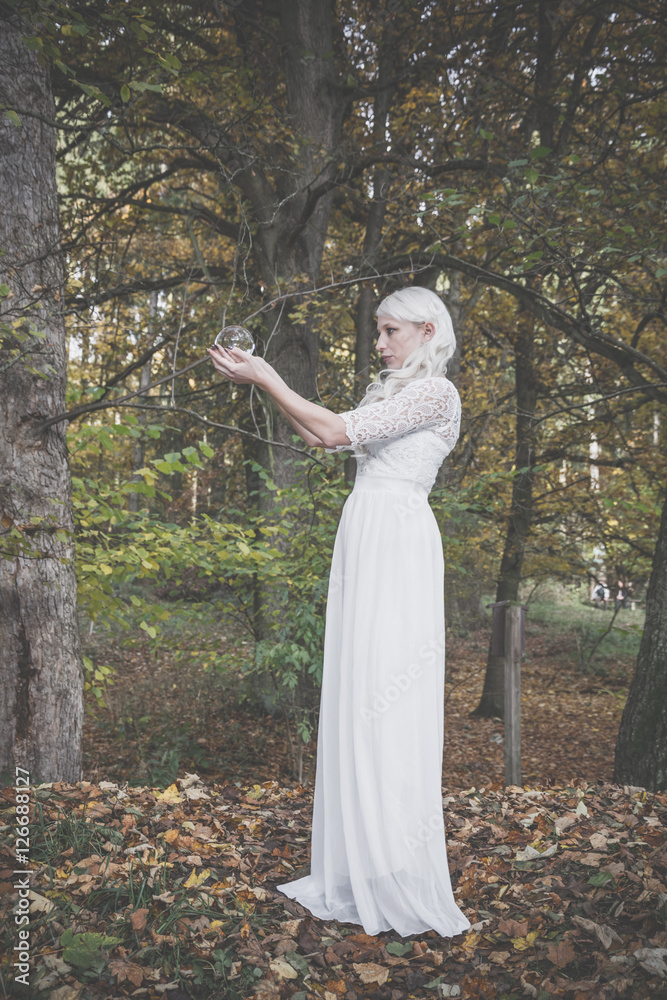 Beautiful tall fortune teller woman in the woods