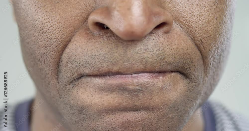 The Man Strongly Displeased/Male African-American strongly angry. His lips pressed tightly together. Breathing frequent. He barely restrains himself The Man Strongly Displeased/Male African-American strongly angry. His lips pressed tightly together. Breathing frequent. He barely restrains himself