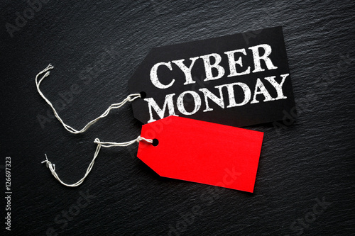 Cyber Monday Sale tags on dark background