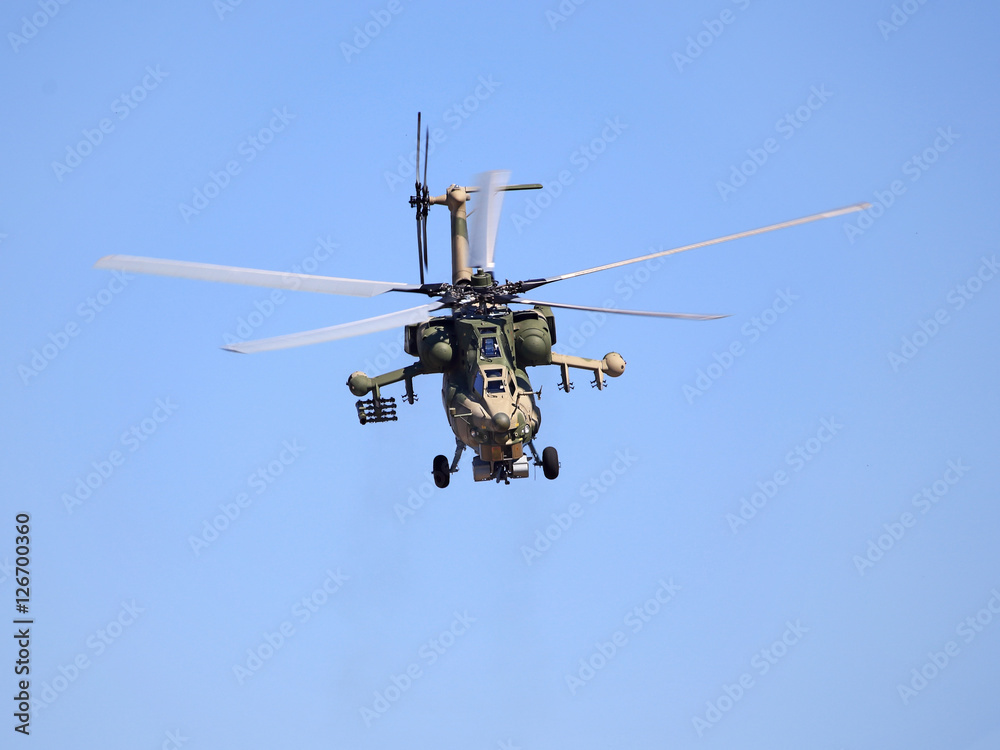 Combat helicopter in flight Combat helicopter in flight