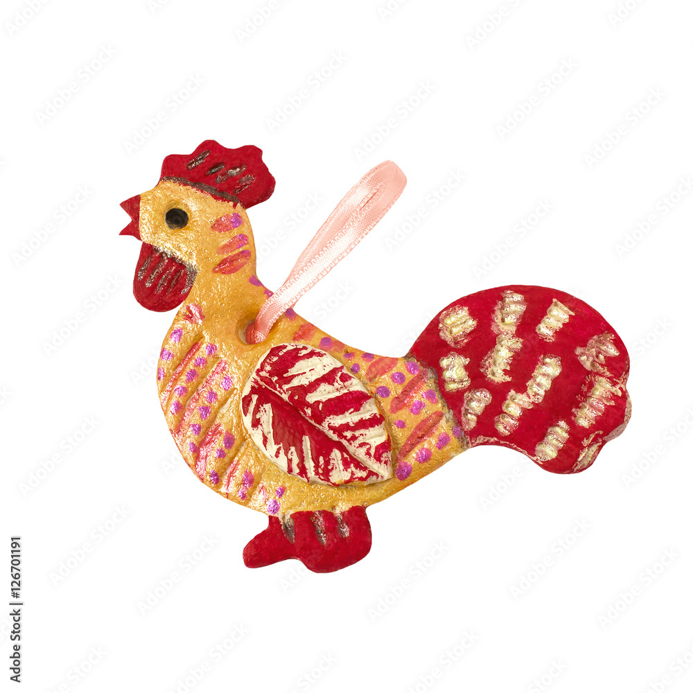 Homemade cock from salt dough on a white background