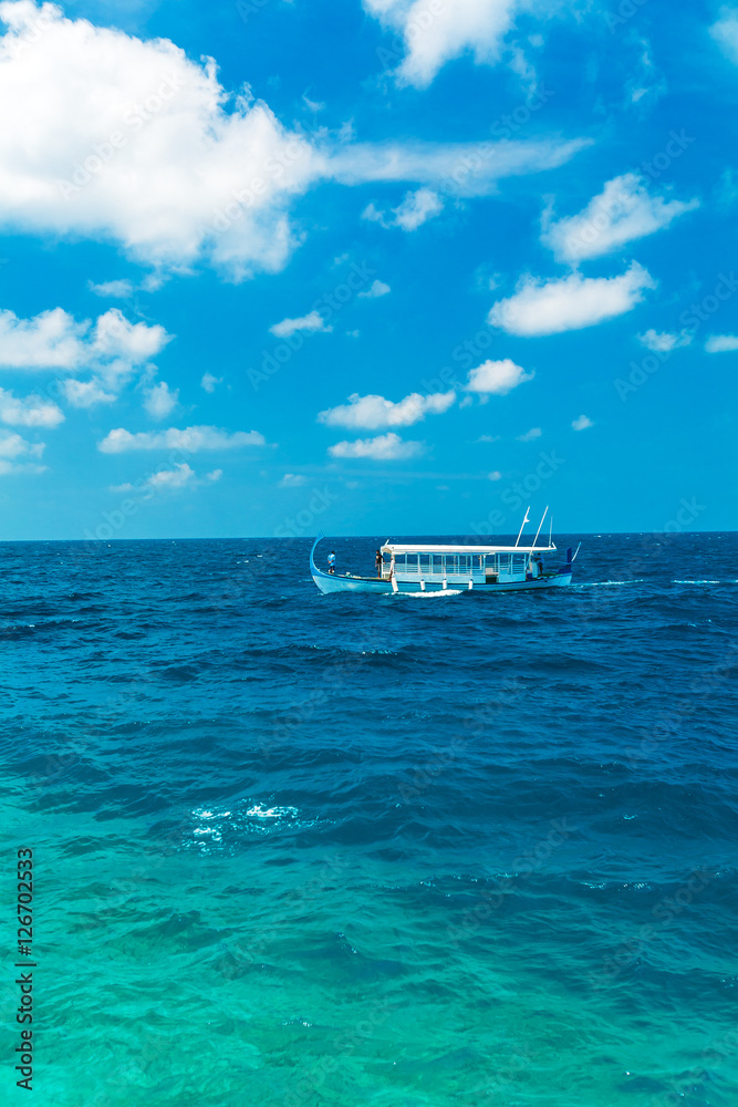 Sea landscape with a traditional Dhoni boat, Maldives