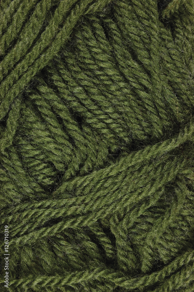 Natural green fine wool threads texture, textured clew macro closeup vertical background pattern Natural green fine wool threads texture, textured clew macro closeup vertical background pattern