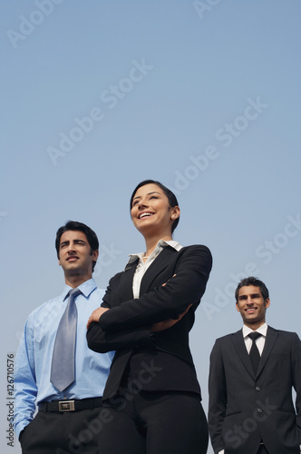 three business colleagues, standing
