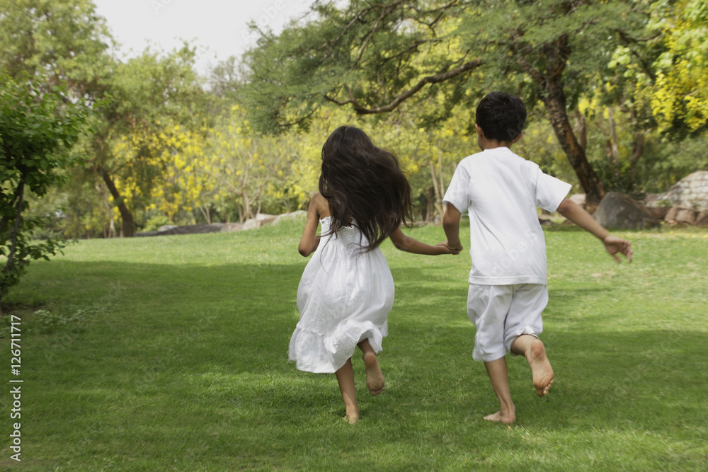 two little children running away
