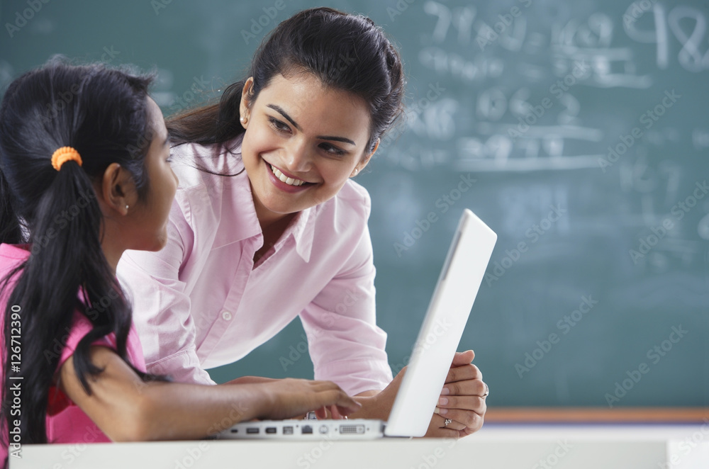 teacher and girl at laptop (horizontal)