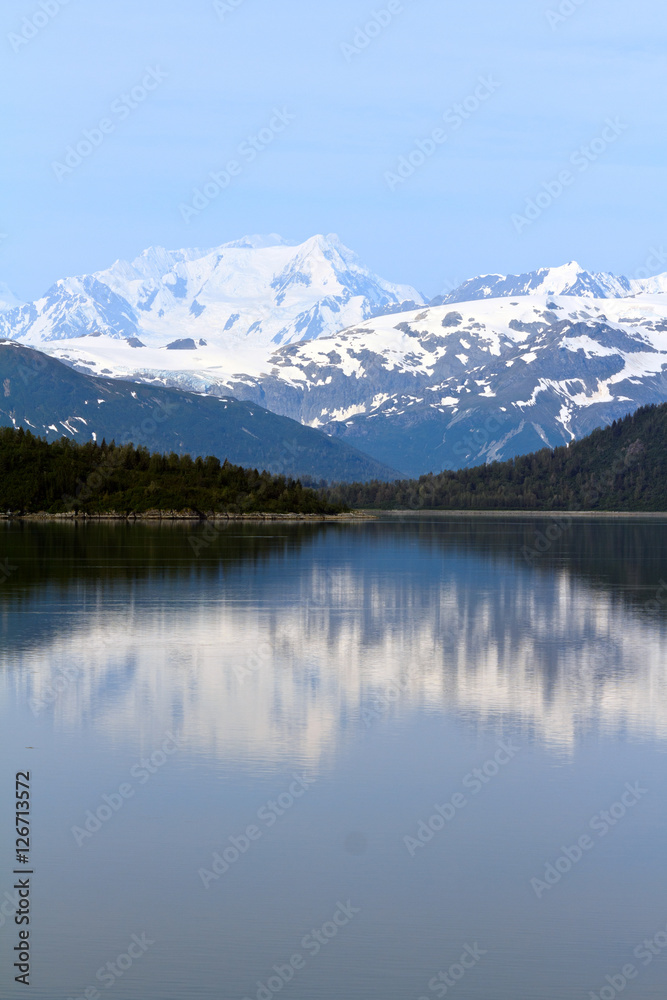 Alaska Landscape with mountains reflecting in the ocean Alaska Landscape with mountains reflecting in the ocean