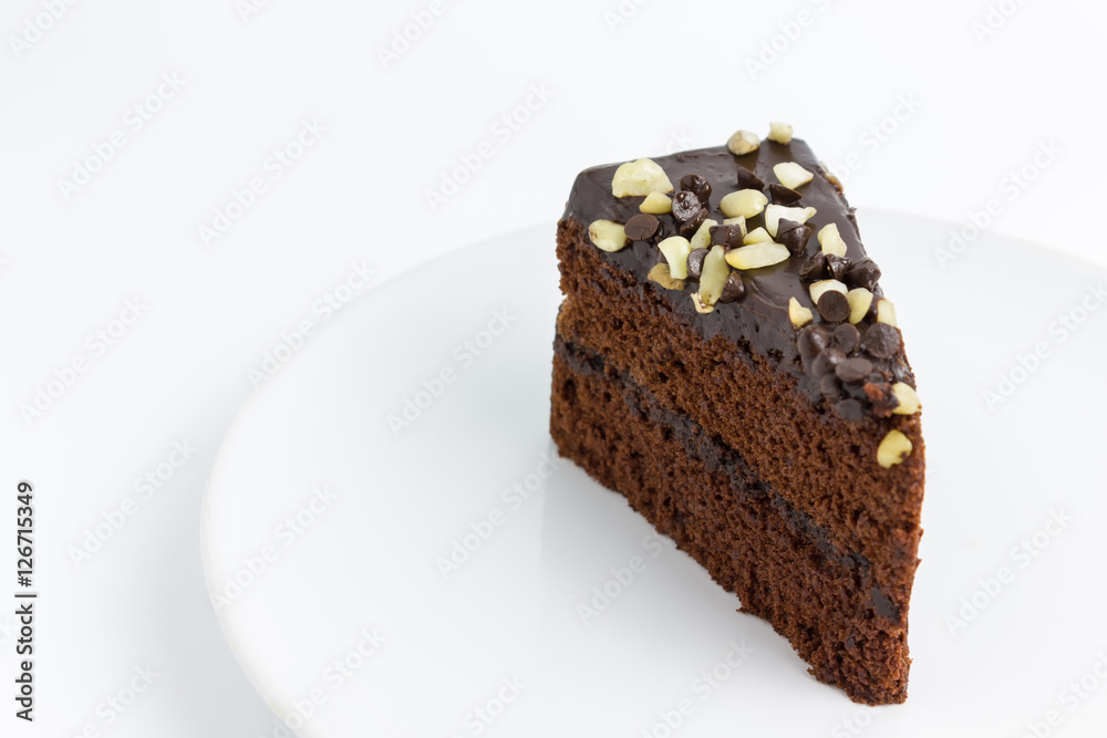 chocolate cake with almond topping on white background chocolate cake with almond topping on white background