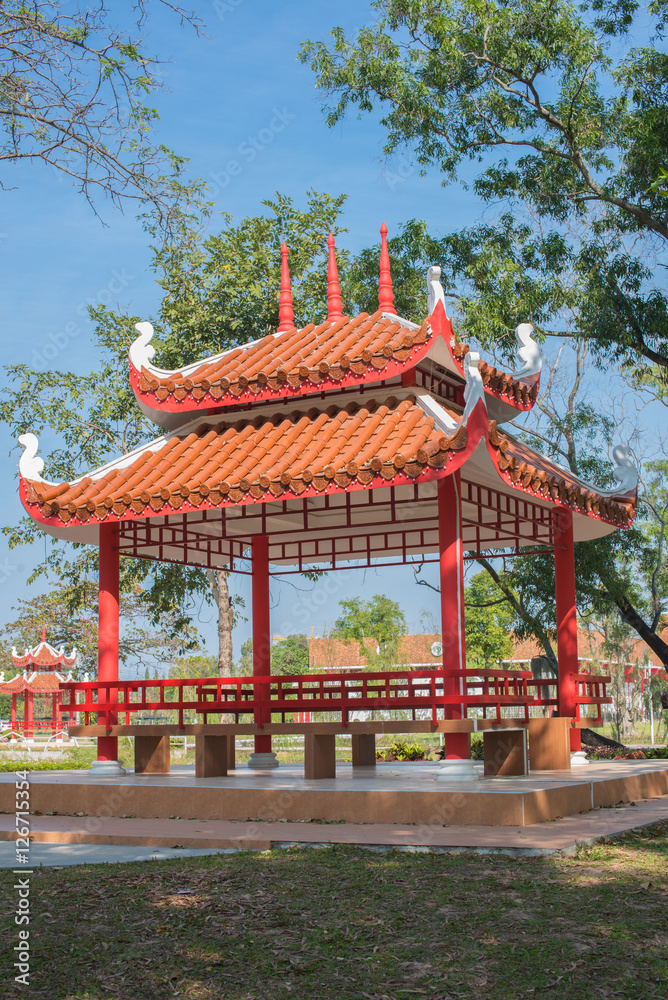 Traditional chinese garden with red pavilion