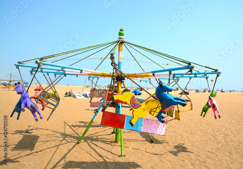 Merry Go Round at Marina Beach in Chennai City, India. Children have lot of fun activities in the beach for playing.