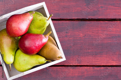 Photography Container with pears over table with copy space