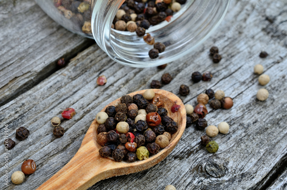 peppercorn in spoon on table peppercorn in spoon on table
