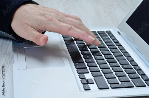 woman hand tasting laptop