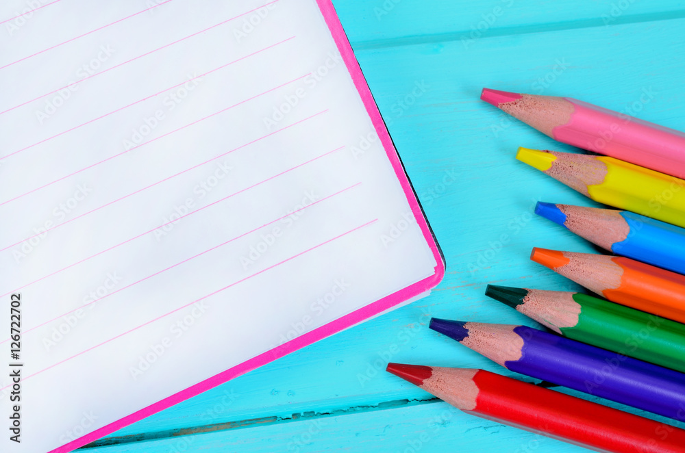 Obraz premium notebook with crayon on table