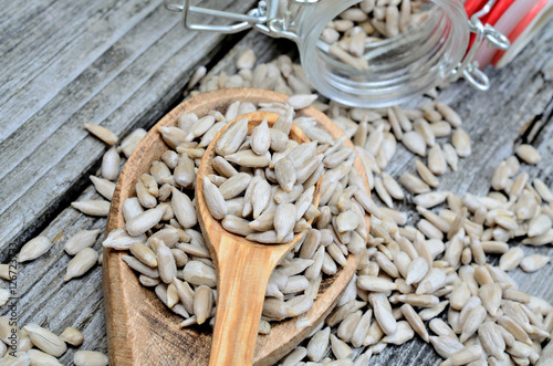 sunflowers seed in spoon on table