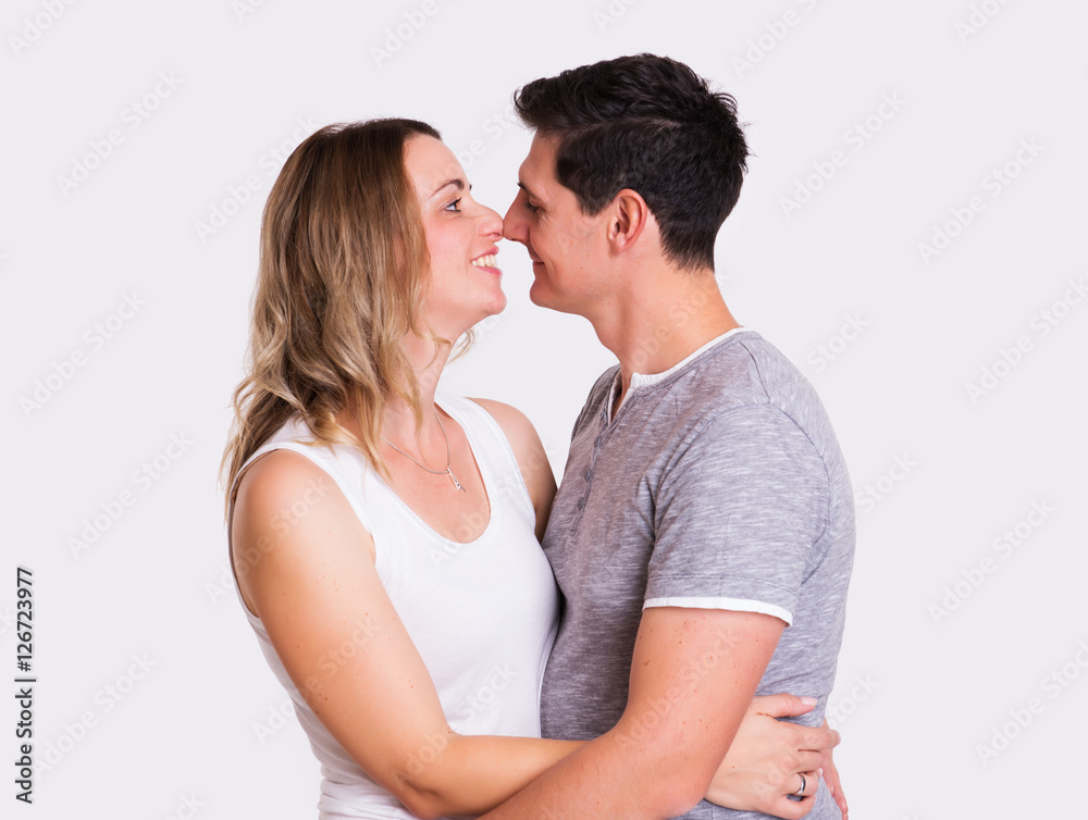 young couple in front of white background young couple in front of white background
