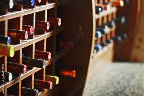 Wooden cells with wine bottles