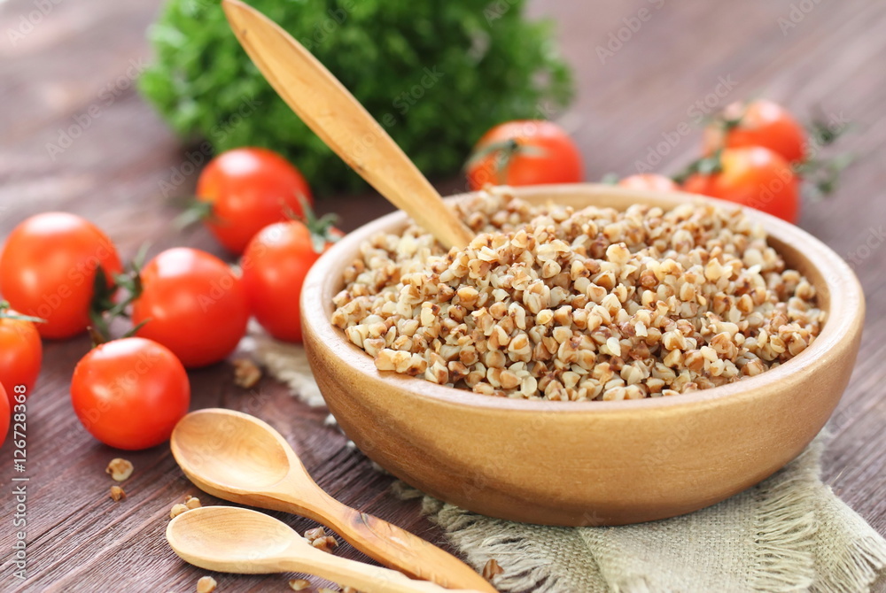 Buckwheat in bowl and fresh vegetables Buckwheat in bowl and fresh vegetables