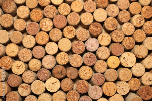 Background of used wine corks. Wall of many different wine corks. Closeup of wine corks.