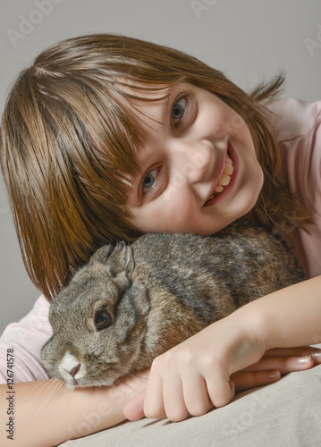 little girl with little rabbit © Vera Kuttelvaserova