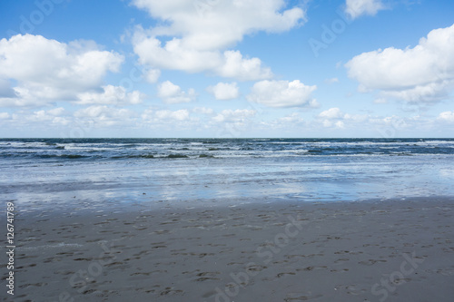 Fototapeta Naklejka Na Ścianę i Meble -  Footprints In The Sand By The Sea