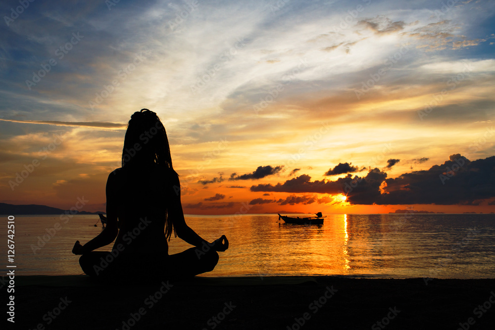 serenity and yoga practicing at sunset, meditation.Twilight in Thailand