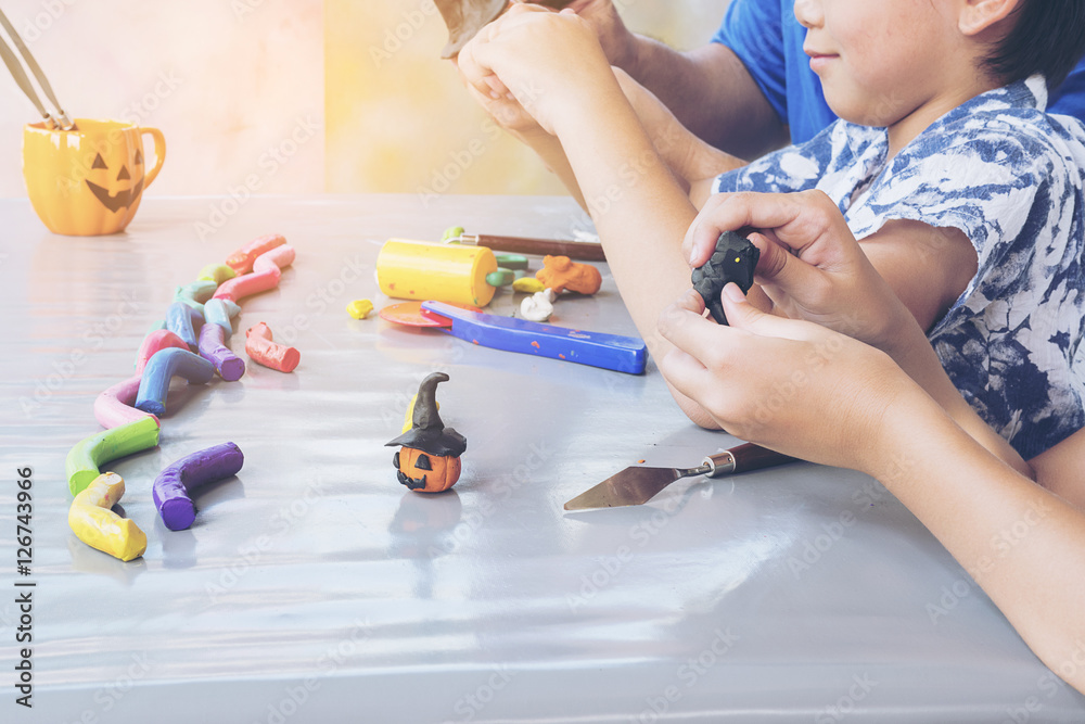 Father is playing clay toy with kid Father is playing clay toy with kid