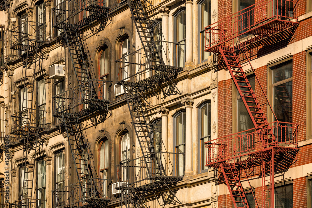 Soho building facades with fire escapes. Manhattan, New York City