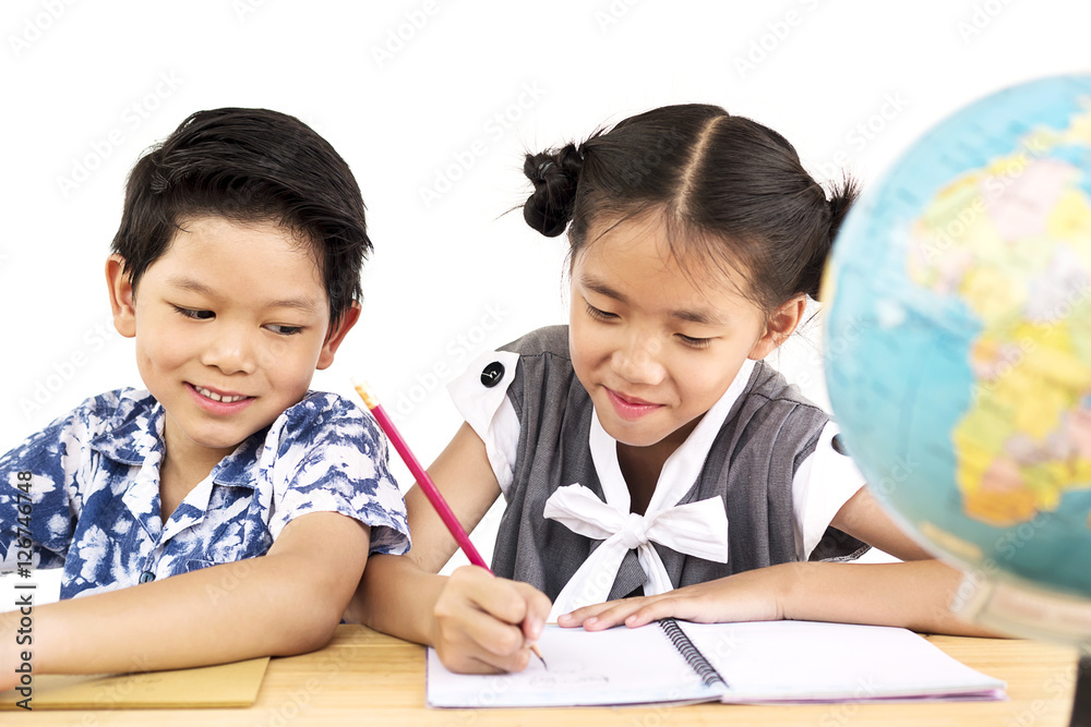 Asian kids are happily studying with blurred globe over white background Asian kids are happily studying with blurred globe over white background