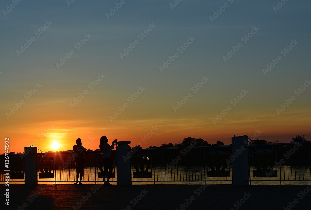 Two girls and sunset/Two girls take turns shooting at each other. In the evening light sunset
Two girls and sunset/Two girls take turns shooting at each other. In the evening light sunset