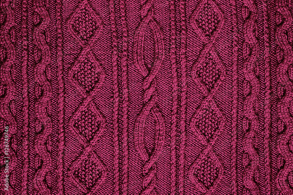 background burgundy knitted fabric with a pattern closeup