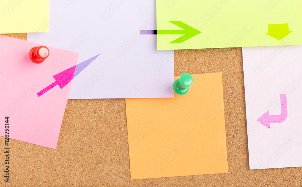 Arrows pointing to empty note on notice board in office. Background or backdrop for business information. Concept image of communication or reminder with copy space. Arrows pointing to empty note on notice board in office. Background or backdrop for business information. Concept image of communication or reminder with copy space.