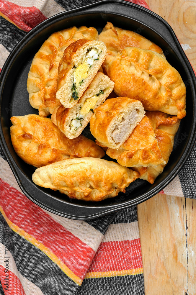 Russian pirozhki baked patties with meat and eggs Russian pirozhki baked patties with meat and eggs