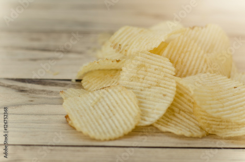 Tomato chips on wooden table, vintage image