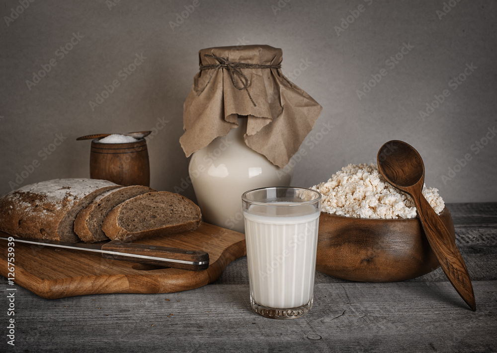 glass of milk, cottage cheese fresh homemade bread with solt on