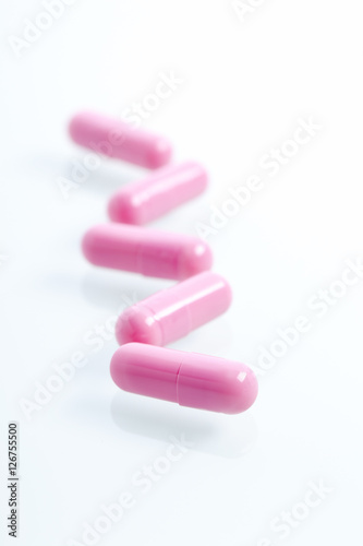 Set of capsules on white background