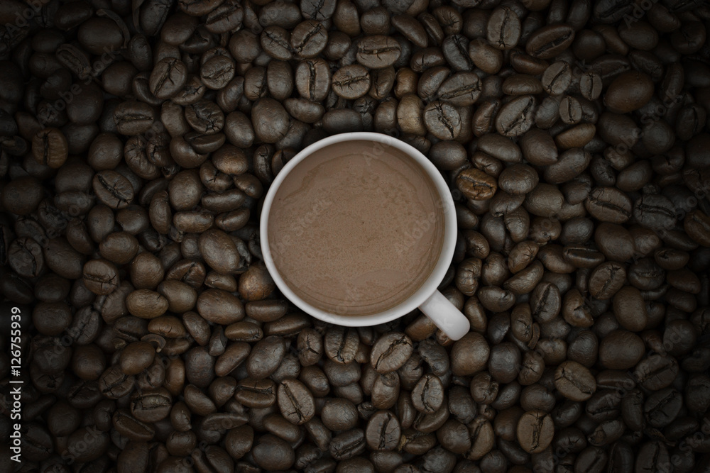 hot coffee in cup on coffee beans background hot coffee in cup on coffee beans background