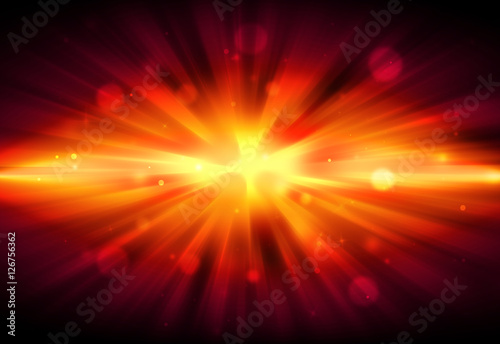 Gold or orange glitter sparkle defocused radial rays lights bokeh beautiful abstract background.
