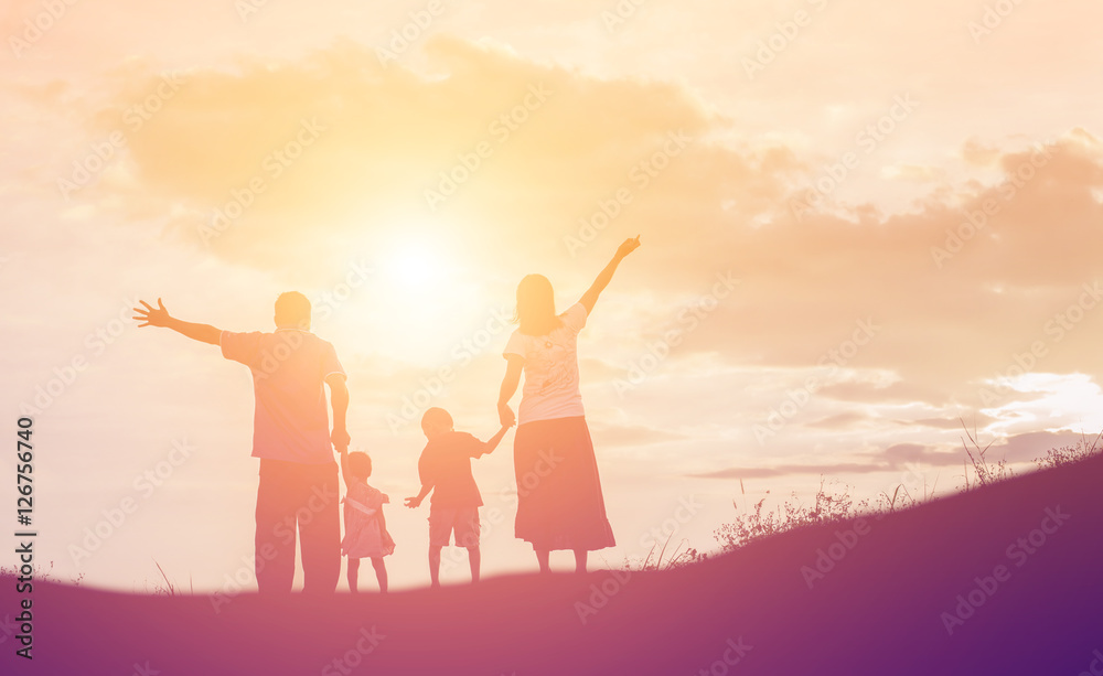 Happy family dancing on the road in the sunset time. Evening par