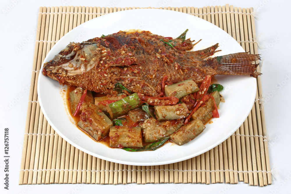 Deep-fried tilapia fish topped Spicy fried eggplant. Deep-fried tilapia fish topped Spicy fried eggplant.