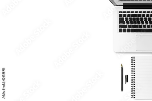 White minimal office desk table with laptop, notebook and pen. Top view with copy space, flat lay. photo