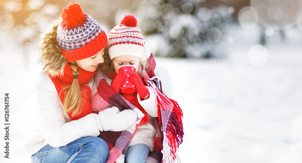 happy family mother and child on winter walk drinking tea happy family mother and child on winter walk drinking tea