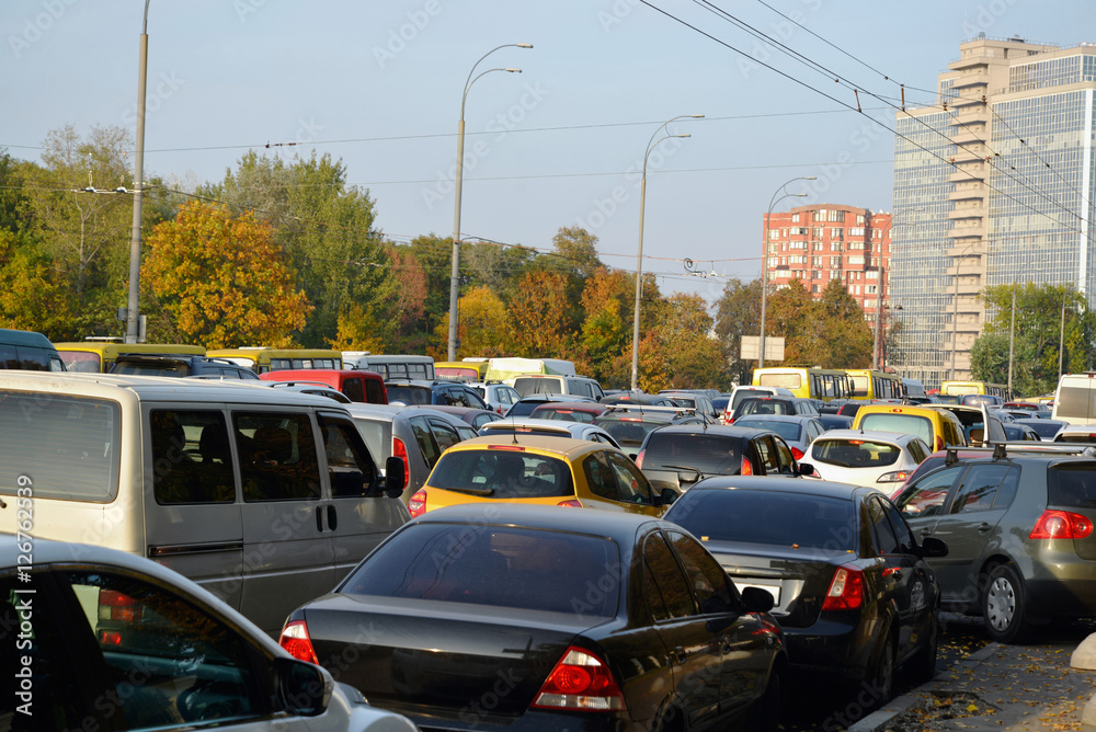 Cars are stuck in a traffic jam on the city road in Kyiv, Ukraine.