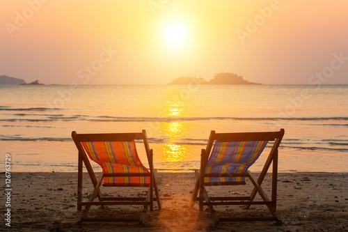 A couple of chairs on sunset beach. © De Visu