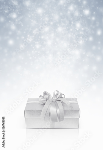 Celebration silver gift box for decoration on snow background © F16-ISO100