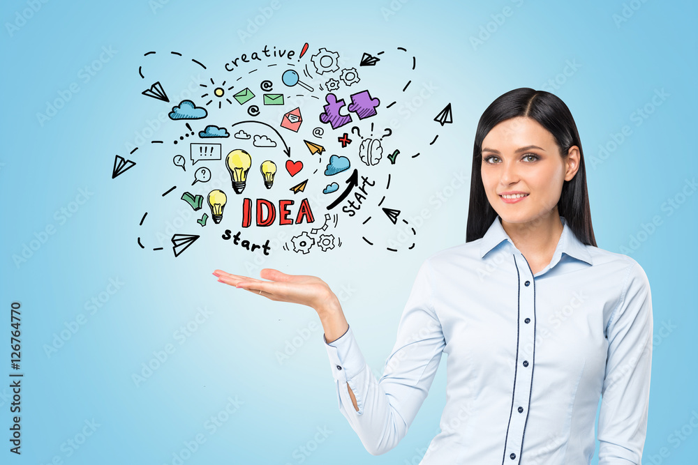 Woman is holding business idea sketch Woman is holding business idea sketch